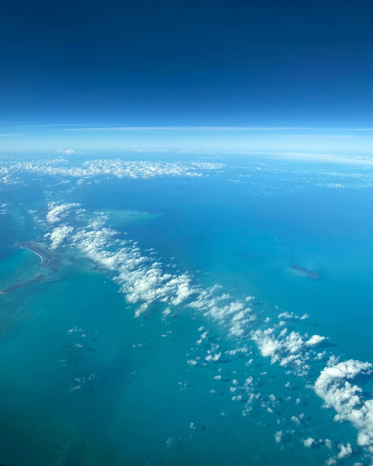 Scattered clouds over the sea seen from high above