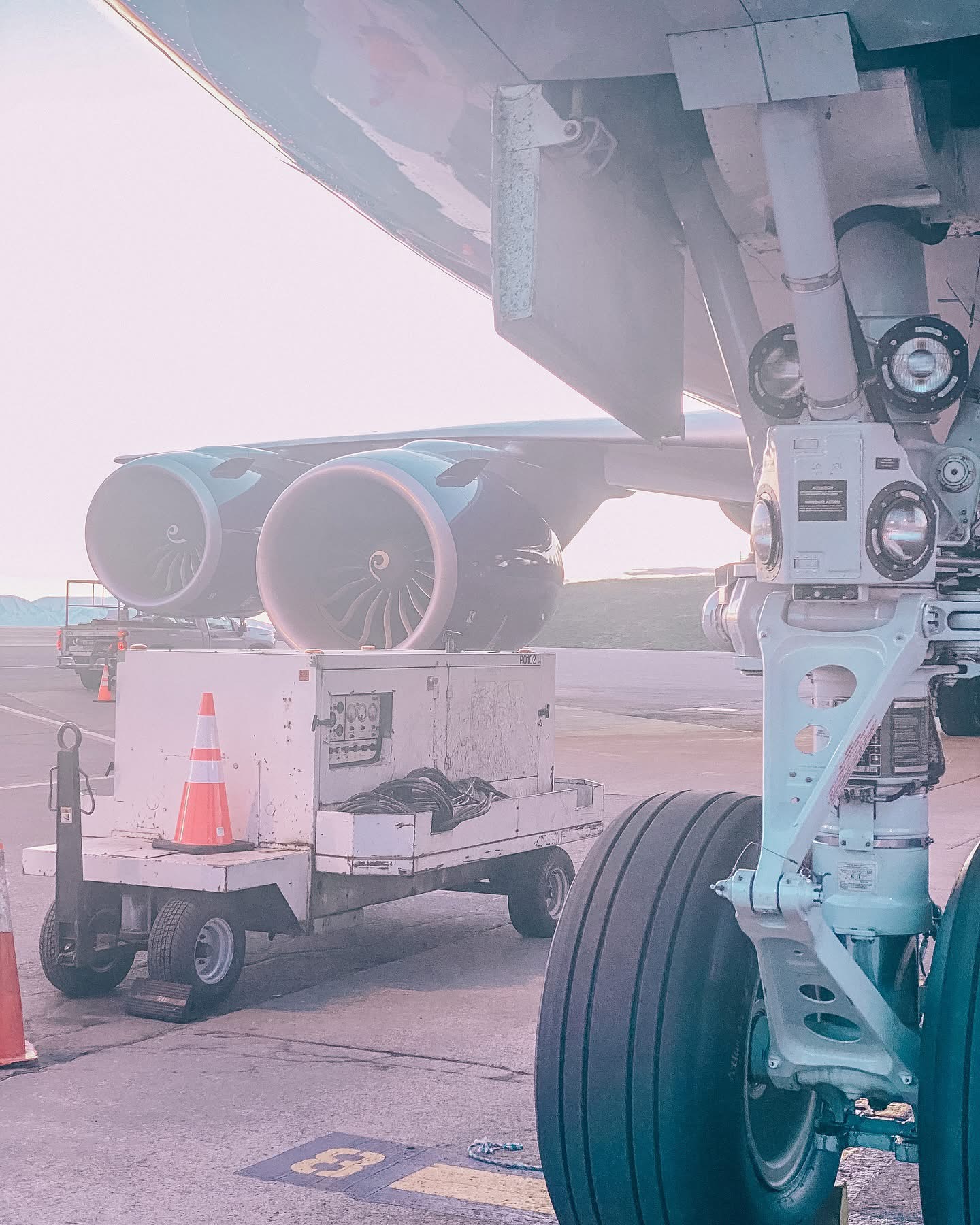 Landing gear and ground equipment beneath a large aircraft